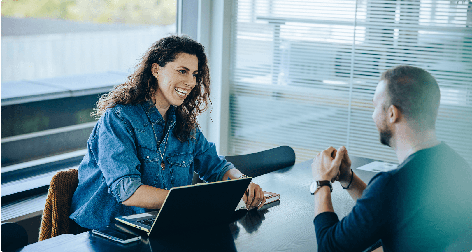 Client happily interacting with a team member
